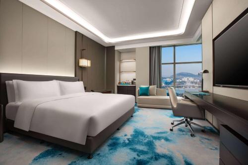 Imagen de la habitación del Hotel Wyndham Grand Zaozhuang. Foto 13