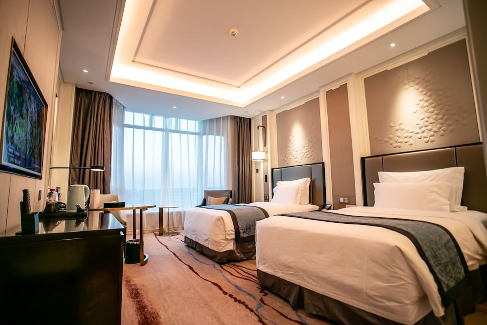 Imagen de la habitación del Hotel Wyndham Qingdao. Foto 16