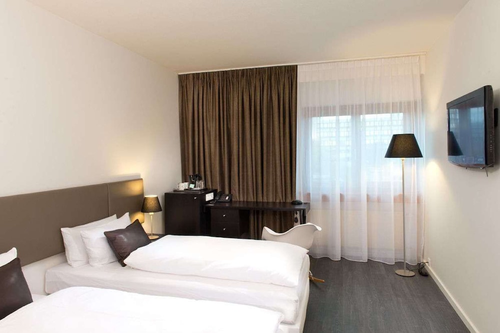 Imagen de la habitación del Hotel Wyndham Stuttgart Airport Messe. Foto 12
