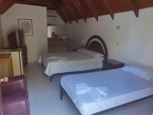Imagen de la habitación del Hotel XILON RESORT MELGaR. Foto 19