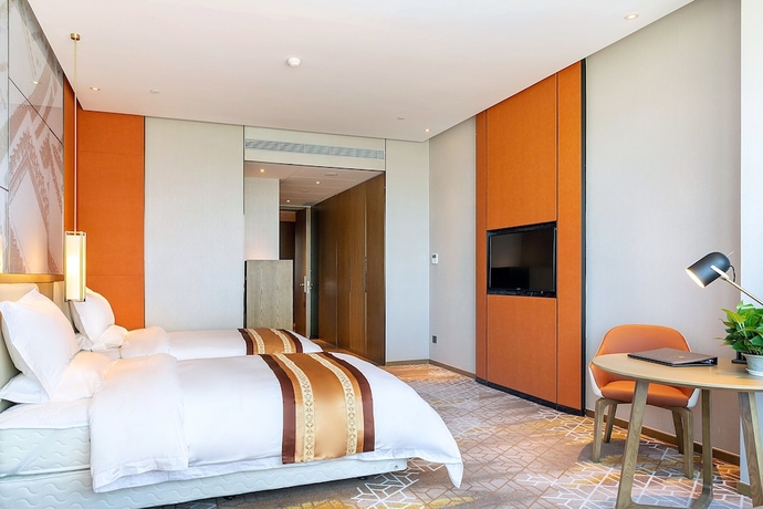 Imagen de la habitación del Hotel XINYU CROWN HOTEL. Foto 3