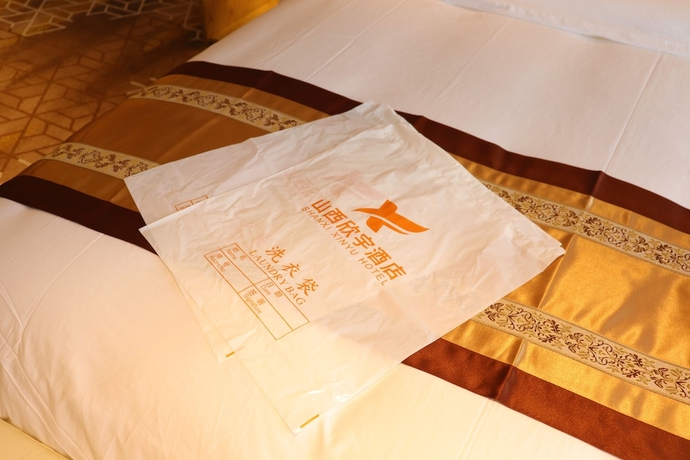 Imagen de la habitación del Hotel XINYU CROWN HOTEL. Foto 4