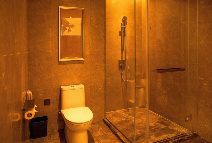 Imagen de la habitación del Hotel XINYU CROWN HOTEL. Foto 5