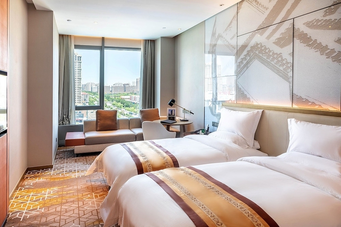 Imagen de la habitación del Hotel XINYU CROWN HOTEL. Foto 6