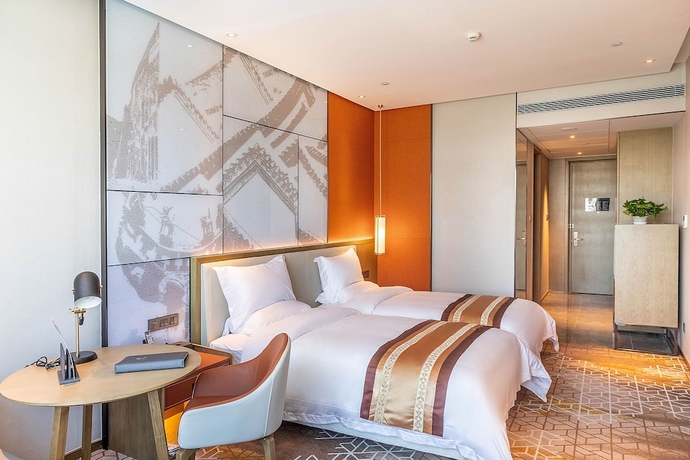 Imagen de la habitación del Hotel XINYU CROWN HOTEL. Foto 7