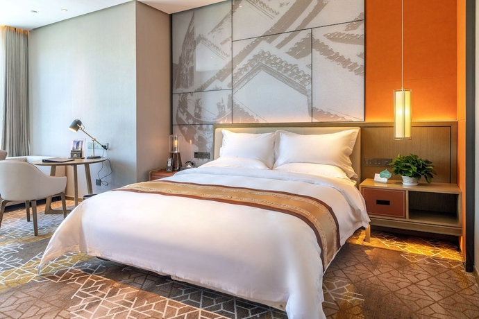 Imagen de la habitación del Hotel XINYU CROWN HOTEL. Foto 8