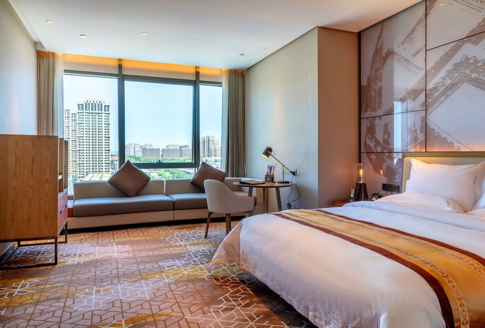 Imagen de la habitación del Hotel XINYU CROWN HOTEL. Foto 9