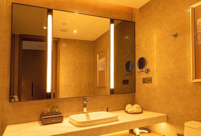 Imagen de la habitación del Hotel XINYU CROWN HOTEL. Foto 10