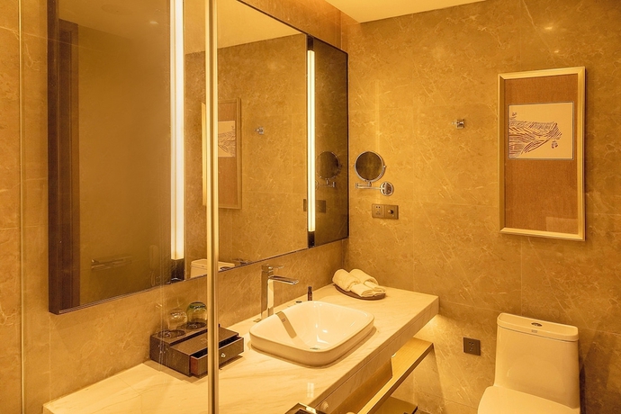 Imagen de la habitación del Hotel XINYU CROWN HOTEL. Foto 11