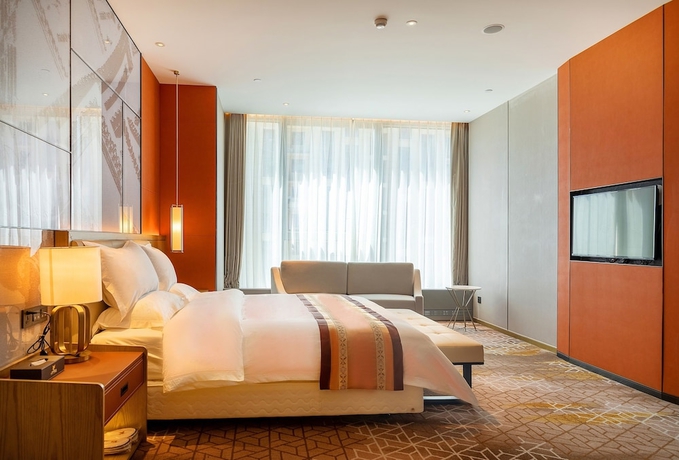 Imagen de la habitación del Hotel XINYU CROWN HOTEL. Foto 12