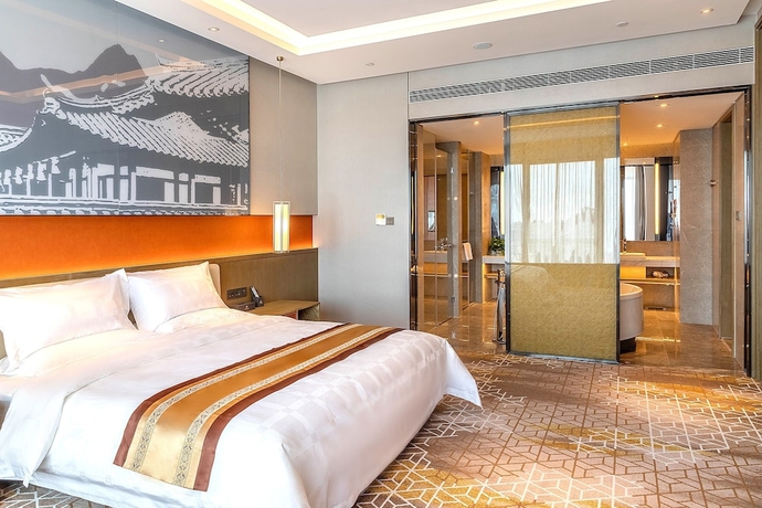 Imagen de la habitación del Hotel XINYU CROWN HOTEL. Foto 13