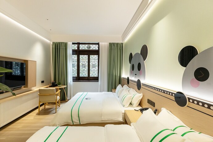 Imagen de la habitación del Hotel XISHU GARDEN INN. Foto 12