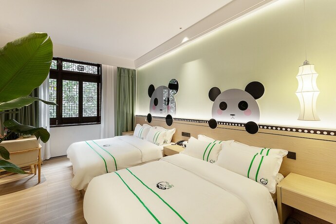 Imagen de la habitación del Hotel XISHU GARDEN INN. Foto 13