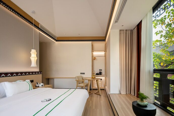 Imagen de la habitación del Hotel XISHU GARDEN INN. Foto 15