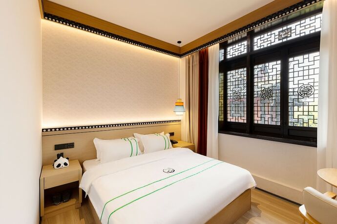 Imagen de la habitación del Hotel XISHU GARDEN INN. Foto 16