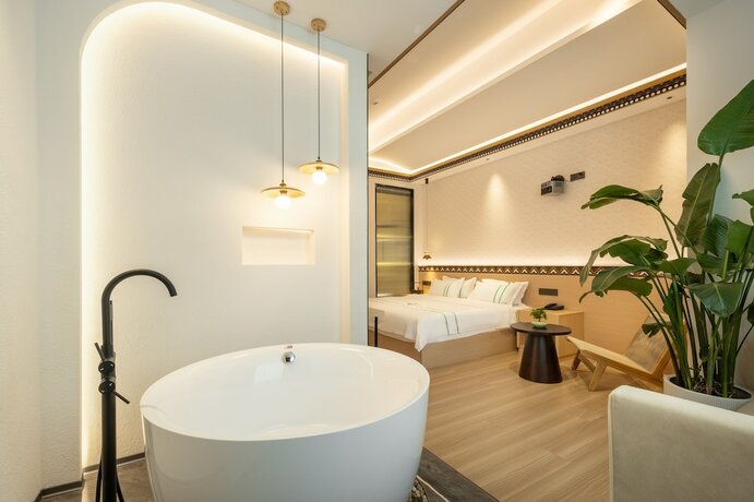 Imagen de la habitación del Hotel XISHU GARDEN INN. Foto 17