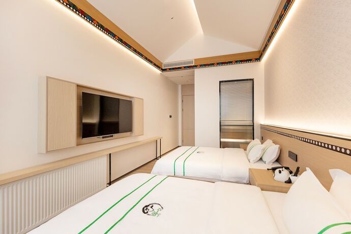 Imagen de la habitación del Hotel XISHU GARDEN INN. Foto 20