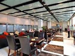 Imagen del bar/restaurante del Hotel Xclusive Clover Creek Hotel Apartments. Foto 2