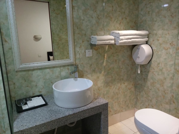 Imagen de la habitación del Hotel Xi, DALIAN. Foto 4