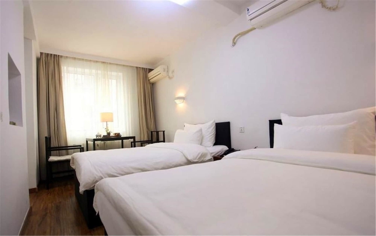 Imagen de la habitación del Hotel Xi, DALIAN. Foto 5