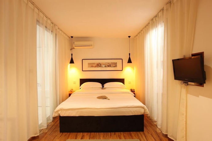 Imagen de la habitación del Hotel Xi, DALIAN. Foto 6