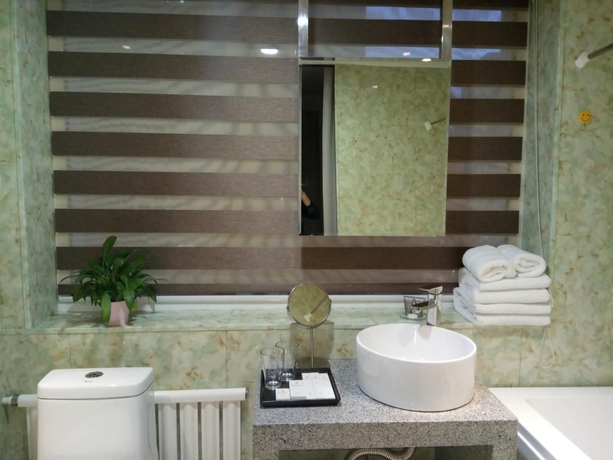 Imagen de la habitación del Hotel Xi, DALIAN. Foto 12