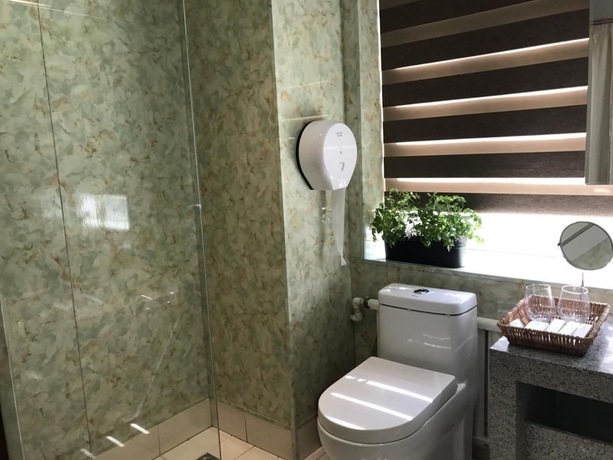 Imagen de la habitación del Hotel Xi, DALIAN. Foto 13