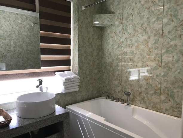 Imagen de la habitación del Hotel Xi, DALIAN. Foto 14