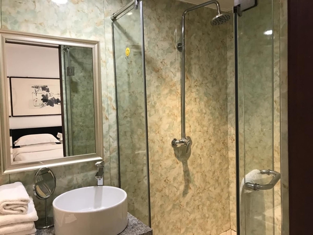 Imagen de la habitación del Hotel Xi, DALIAN. Foto 15