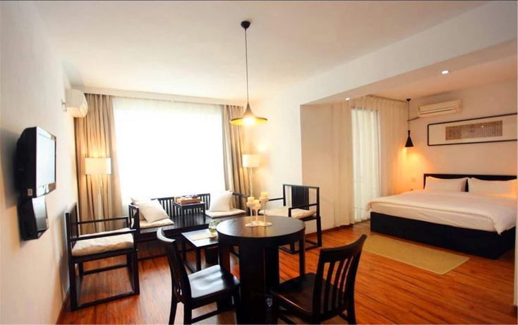 Imagen de la habitación del Hotel Xi, DALIAN. Foto 16
