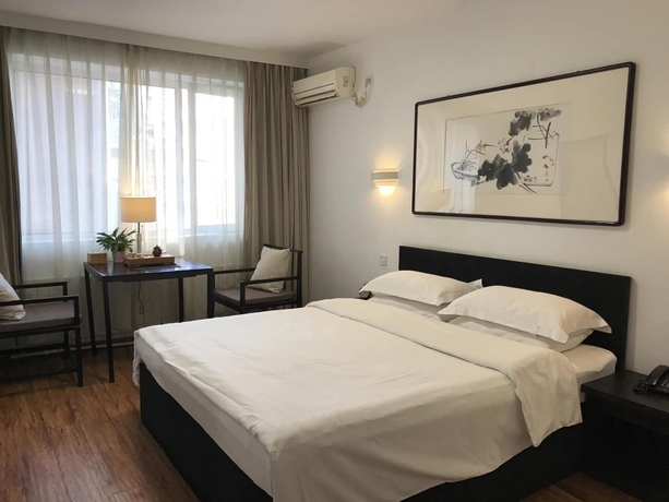 Imagen de la habitación del Hotel Xi, DALIAN. Foto 18