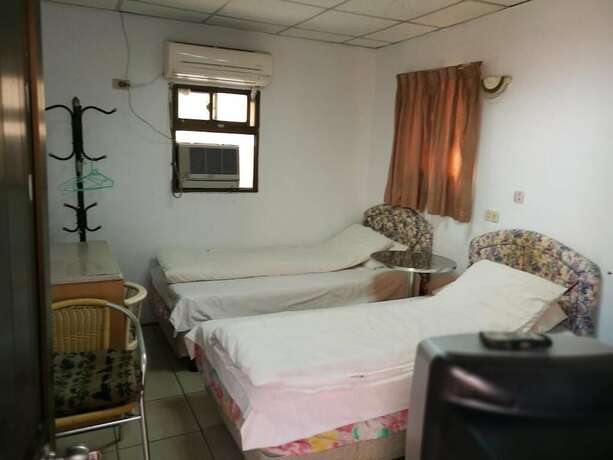 Imagen de la habitación del Hotel Xia Xing Inn. Foto 20