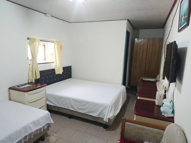 Imagen de la habitación del Hotel Xia Xing Inn. Foto 21