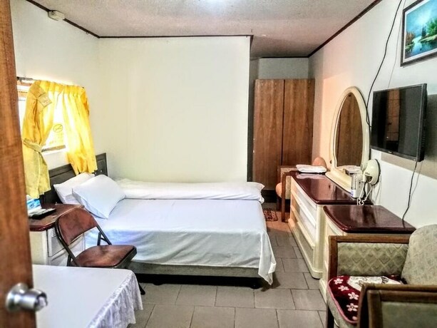 Imagen de la habitación del Hotel Xia Xing Inn. Foto 22