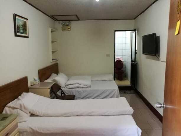 Imagen de la habitación del Hotel Xia Xing Inn. Foto 24