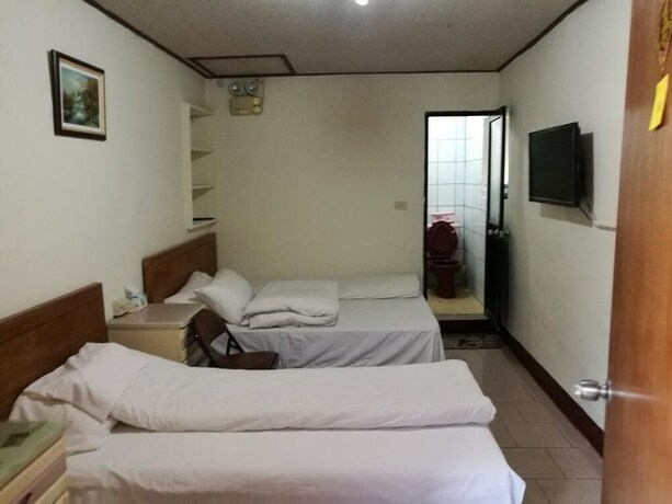 Imagen de la habitación del Hotel Xia Xing Inn. Foto 25