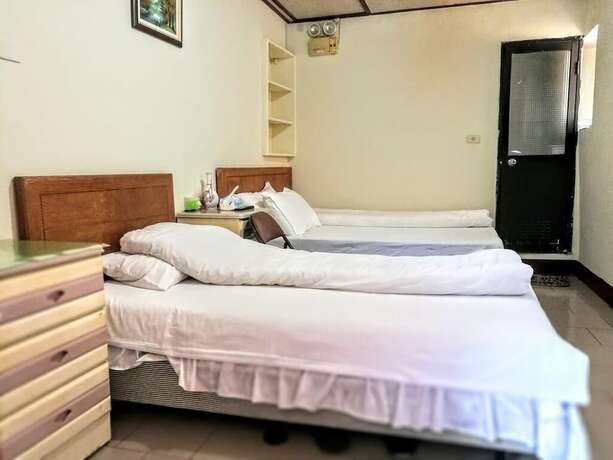 Imagen de la habitación del Hotel Xia Xing Inn. Foto 26