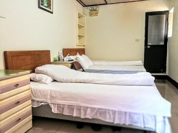 Imagen de la habitación del Hotel Xia Xing Inn. Foto 27