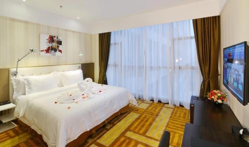 Imagen de la habitación del Hotel Xiamen Discovery. Foto 7