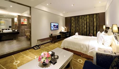 Imagen de la habitación del Hotel Xiamen Discovery. Foto 9