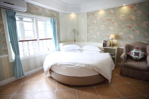 Imagen de la habitación del Hotel Xiamen Gulangyu Aifeier Guanglangyu Blue Isl. Foto 9