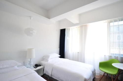 Imagen de la habitación del Hotel Xiamen Gulangyu Heitan. Foto 7