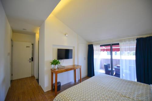 Imagen de la habitación del Hotel Xiamen Gulangyu Heitan. Foto 8