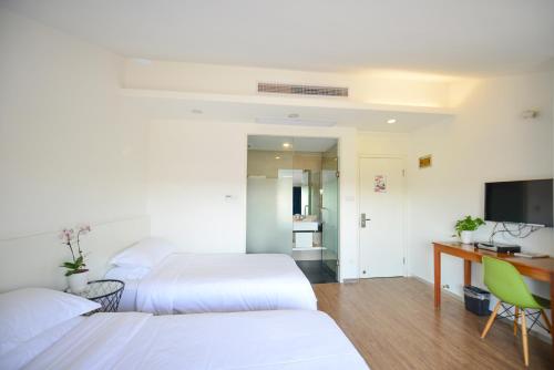 Imagen de la habitación del Hotel Xiamen Gulangyu Heitan. Foto 9
