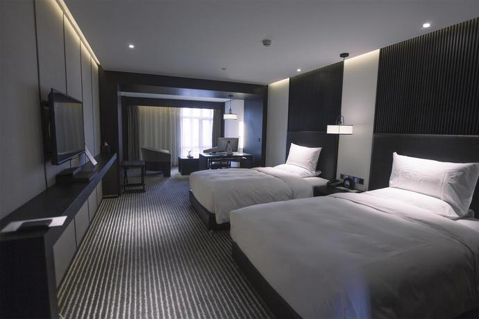 Imagen de la habitación del Hotel Xi'an Eastern House Boutique. Foto 13