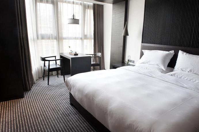 Imagen de la habitación del Hotel Xi'an Eastern House Boutique. Foto 15