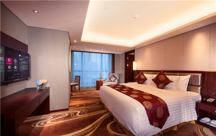 Imagen de la habitación del Hotel Xian Grand New Century Hotel. Foto 2
