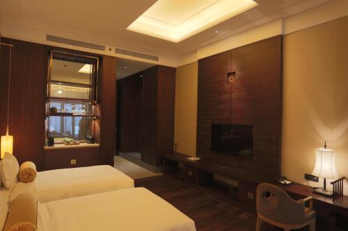 Imagen de la habitación del Hotel Xian Huaqingyutang, Lintong. Foto 1