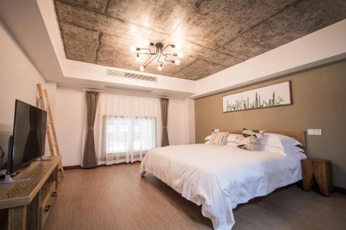 Imagen de la habitación del Hotel Xian Ju Bu She Ban Juan Min Su. Foto 7