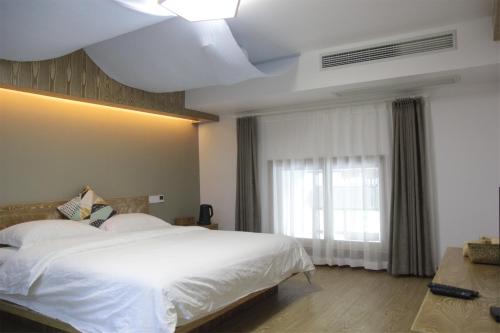 Imagen general del Hotel Xian Ju Bu She Ban Juan Min Su. Foto 5